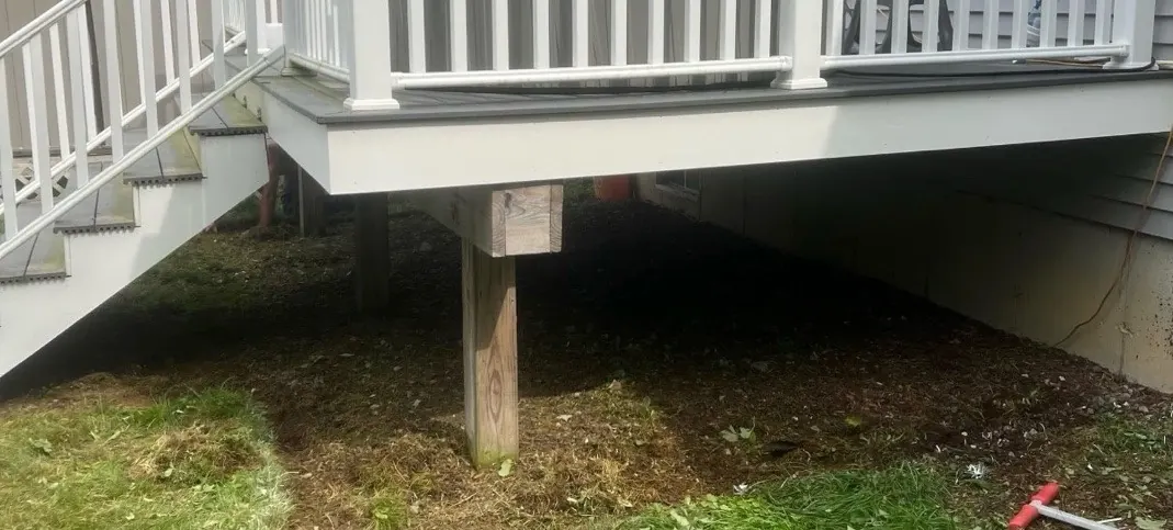 Before cleanup - messy area under deck